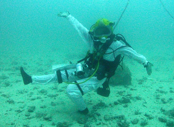 NEEMO 15's Shannon Walker (NASA astronaut) does a little dance during a simulated asteroid mission. Credit: NASA