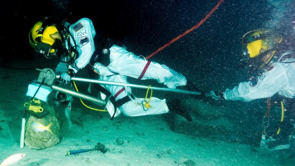 Shannon Walker (NASA) and David Saint-Jacques (Canadian Space Agency) using a small boom during NEEMO 15. Credit: NASA