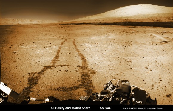 NASA’s Curiosity rover trundles towards Mount Sharp (right) across the alien terrain of Mars - our Solar Systems most Earth-like planet - and leaves behind dramatic wheel tracks in her wake, with Gale crater rim visible in the distance at left. Curiosity captured this photo mosaic of her wheel tracks, mountain and crater rim on Sol 644 after departing ‘Kimberley’ drill site in mid-May 2014. Navcam raw images were stitched and colorized. Credit: NASA/JPL-Caltech/Marco Di Lorenzo/Ken Kremer – kenkremer.com