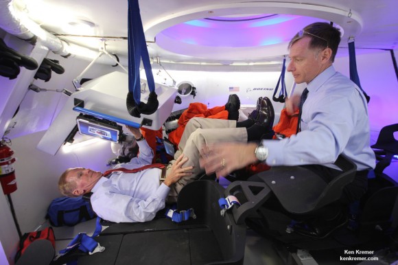 US Senator Bill Nelson (FL) and NASA’s final space shuttle commander inside Boeing’s CST-100 manned capsule during unveiling ceremony at the Kennedy Space Center, Florida on June 9, 2014. Nelson is seated below pilots console and receives CST-100 briefing from Ferguson who now directs Boeing’s crew efforts. Nelson also flew in space aboard the Columbia shuttle in Jan. 1986. Credit: Ken Kremer - kenkremer.com