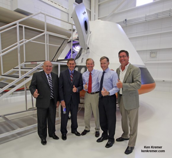 Boeing CST-100 spaceship unveiled at Kennedy Space Center FL on June 9, 2014 Posing from left to right; Frank DelBello, Space Florida, John Elbon, Boeing VP Space Exploration, US Sen. Bill Nelson (FL), final shuttle commander Chris Ferguson, Boeing Director of Crew and Mission Operations and John Mulholland, Boeing VP Commercial Space Exploration. Credit: Ken Kremer - kenkremer.com