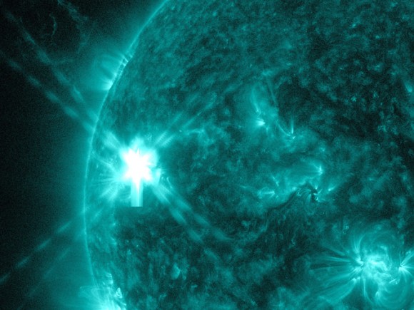 A moderate solar flare erupts on the sun July 8, 2014 in this image from NASA's Solar Dynamics Observatory. The image uses a wavelength of light (131 Angstroms) that emphasizes the hot material of the sun. Credit: NASA/SDO
