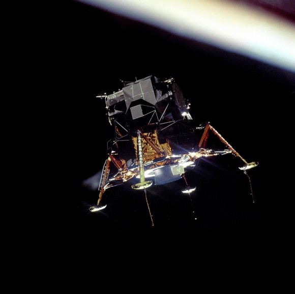 The Eagle Prepares to Land.  The Apollo 11 Lunar Module Eagle, in a landing configuration was photographed in lunar orbit from the Command and Service Module Columbia. Inside the module were Commander Neil A. Armstrong and Lunar Module Pilot Buzz Aldrin. The long rod-like protrusions under the landing pods are lunar surface sensing probes. Upon contact with the lunar surface, the probes sent a signal to the crew to shut down the descent engine.  Image Credit: NASA