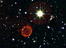 Caption: This image shows a field that contains a newly discovered photogenic planetary nebulae. Internally dubbed by the research team as the "Jelly-Fish PN" it shows an almost circular ring of emission from molecular hydrogen with a variety of structure in the ring itself and inside. The central ionizing source responsible for the radiation is a white dwarf, which is too faint at the near infrared wavelengths to be visible in the image. Image Credit: University of Kent