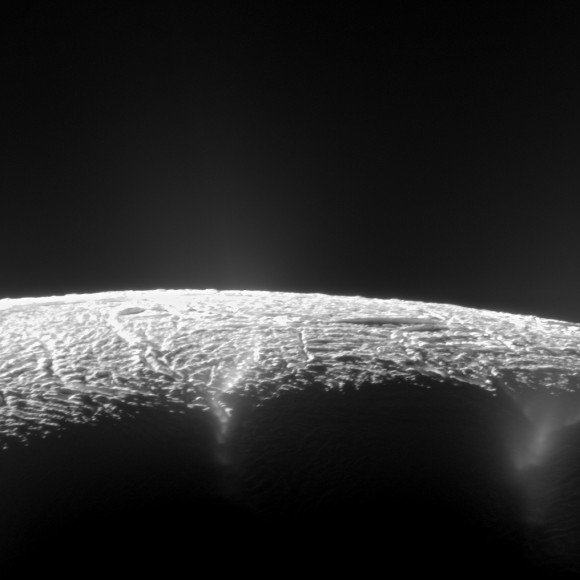 This dramatic view looks across the region of Enceladus' geyser basin and down on the ends of the Baghdad and Damascus fractures that face Saturn. The image, which looks approximately in the direction of Saturn, was taken from a more elevated viewpoint than other Cassini survey images of this area of the moon's south pole. Credit: NASA/JPL-Caltech/SSI