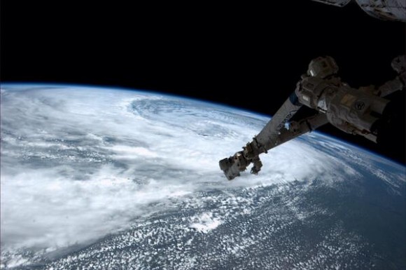Storm begins to swirl near Winnipeg, Canada, as seen from the International Space Station on June 29, 2014. Image taken by astronaut Reid Wiseman. Credit: NASA.