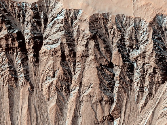 This image covers a location that has been imaged several times to look for changes in gullies. This is in the Terra Sirenum region, part of the southern highlands in the mid-latitudes. Credit: NASA/JPL/University of Arizona.