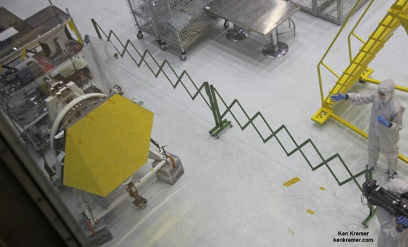 Gold coated flight spare of a JWST primary mirror segment made of beryllium and used for test operations inside the NASA Goddard clean room. Credit: Ken Kremer- kenkremer.com