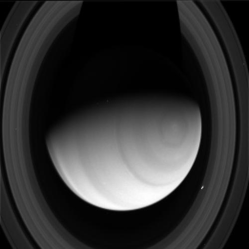 A dark shadow falls across Saturn and its rings in this raw image taken by the Cassini spacecraft July 2, 2014. Credit: NASA/JPL/Space Science Institute