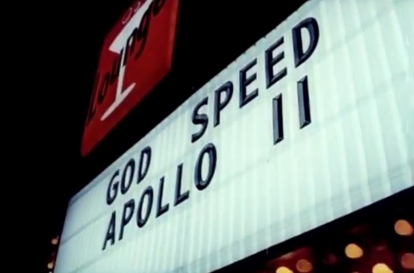 A sign wishing the Apollo 11 crew good luck prior to the launch on July 16, 1969. Screenshot from the 1970 documentary "Moonwalk One." Credit: NASA/Theo Kamecke/YouTube