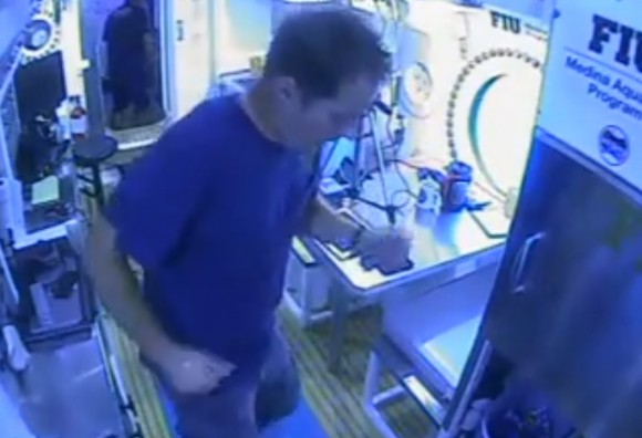 Thomas Pesquet, an astronaut and member of the NEEMO 18 crew, dances in the kitchen of the Aquarius underwater lab in July 2014. Credit: Ian Benecken / YouTube