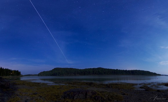 The International Space Station (ISS) makes a 71º maximum elevation pass over the Little Kennebec Bay, in Roque Bluffs, Maine. The photo is a five-frame vertical panorama with the ISS's path composited. Credit and copyright: David Murr.