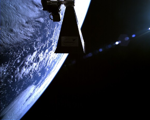 Image of the TechDemoSat-1 in orbit, taken minutes after separation of the satellite from the Soyuz-2 launcher and shows a view of the Earth from Space, with the spacecraft's Antenna Pointing Mechanism in view. Credit: SSTL.