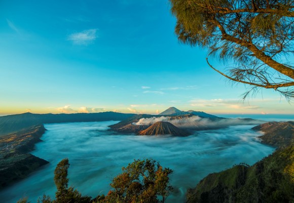 Fog surrounds the volcanoes of Tengger-Bromo-Semeru Park in Java, Indonesia. Credit and copyright: Thierry Legault.
