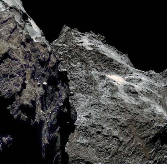 Jagged cliffs and prominent boulders are visible in this color image taken by OSIRIS, the Rosetta spacecraft's scientific imaging system, on September 5, 2014 from a distance of 38.5 miles (62 km). Credit: ESA/Rosetta/MPS for OSIRIS team