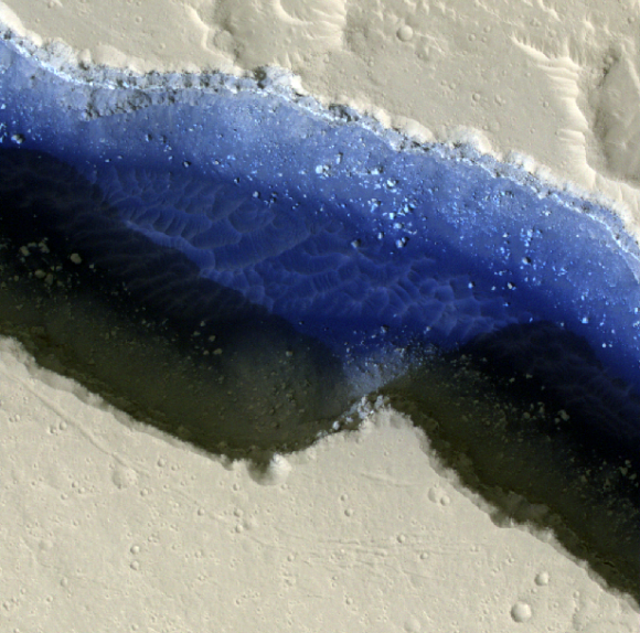 A false-color image of part of Cerberus Fossae on Mars. The view shows two rifts intersecting with each other, with sand (in deep blue) and dust. Credit: NASA/JPL-Caltech/University of Arizona/Western University Planetary Sciences Division