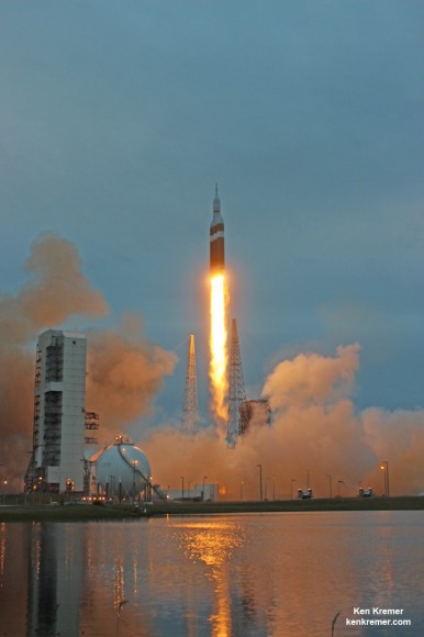 NASA's first Orion spacecraft blasts off at 7:05 a.m. atop United Launch Alliance Delta 4 Heavy Booster at Space Launch Complex 37 (SLC-37) at Cape Canaveral Air Force Station in Florida on Dec. 5, 2014.   Launch pad remote camera view.   Credit: Ken Kremer - kenkremer.com