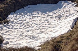 Suncups form when sunlight ablates melts compacted snow. Credit: Derek Harper / Wikipedia 