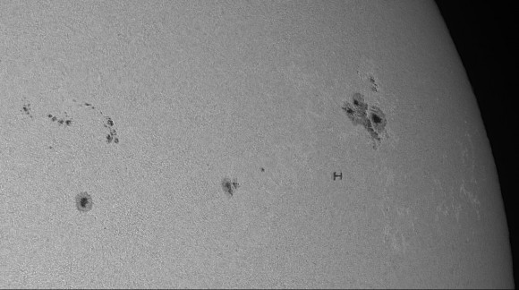 Solar transit of the Chinese space station Tiangong-1 with the Shenzhou-10 module docked, taken from Southern France on June 16, 2013 at 12:14:50 UTC; using a white light filter.  Credit and copyright: Thierry Legault.